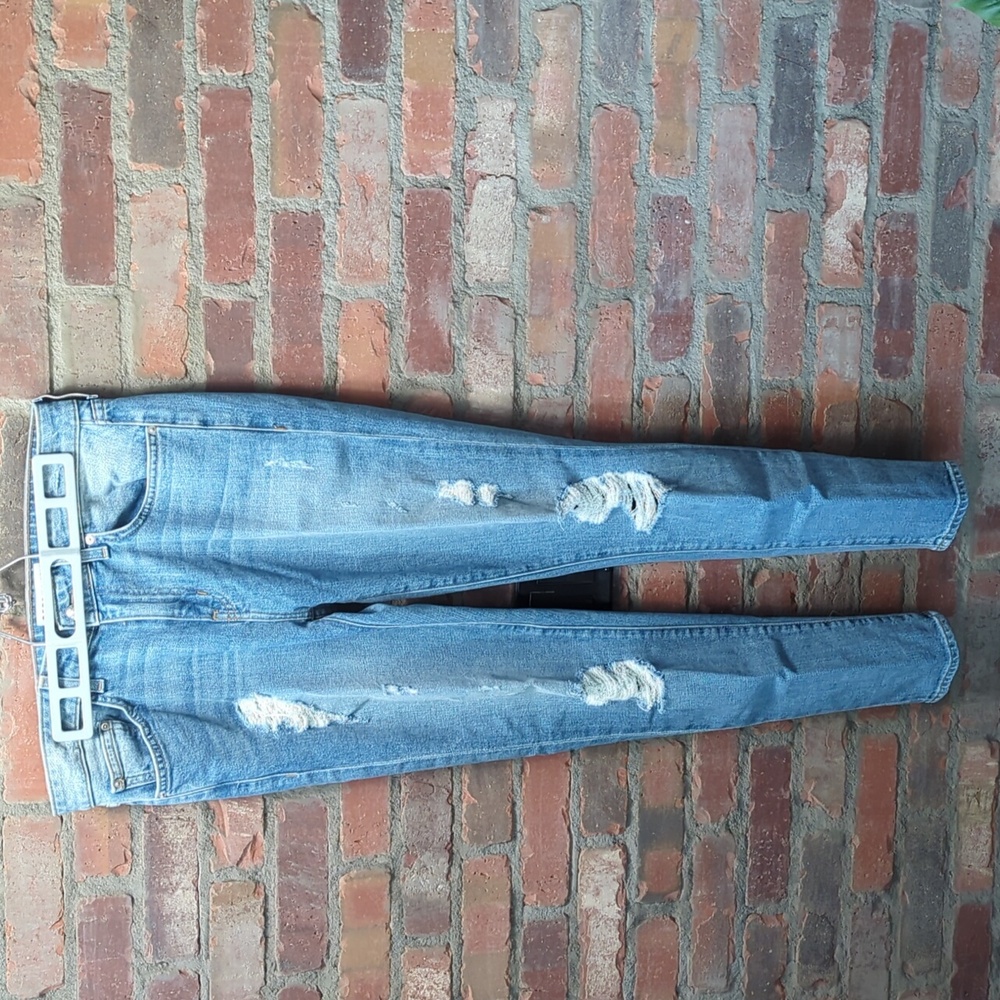 Mid-rise distressed skinny jeans